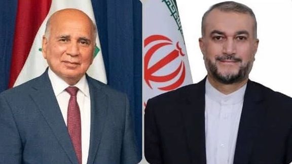 Iraqi Foreign Minister Fuad Hussein (left) and Iranian Foreign Minister Hossein Amir-Abdollahian