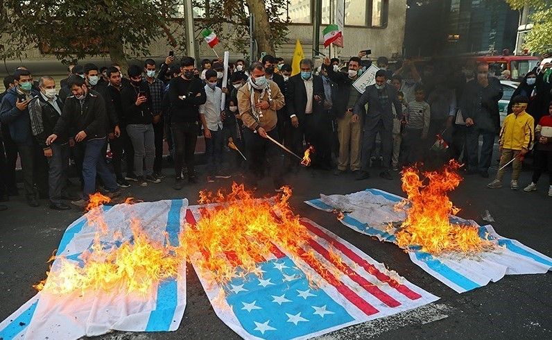 Burning US and Israeli flags is a common practice at government events in Iran. November 4, 2021
