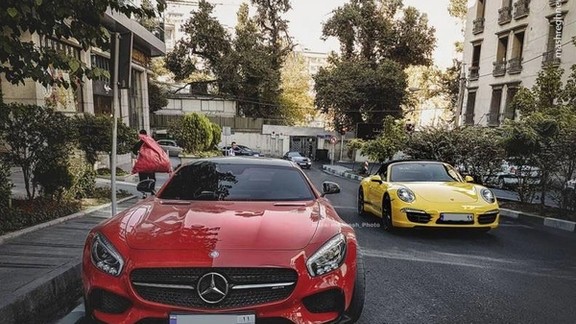 Luxury cars in an expensive part of Tehran.