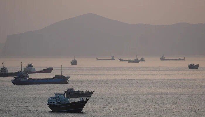 Iran takes US response to cabinet, Hormuz clashes continue