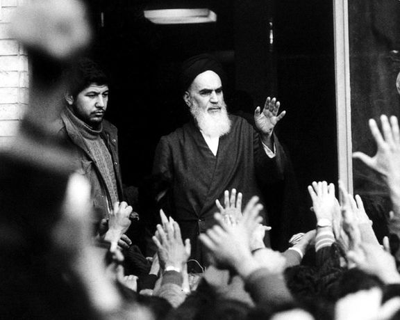 The late leader and founder of the Islamic revolution Ayatollah Khomeini speaks from a balcony of the Alavi school in Tehran, Iran, during the country's revolution in February 1979.