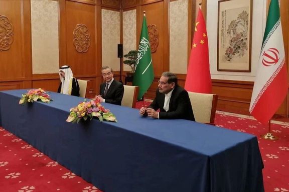 Ali Shamkhani (R) with China's Wang Yi and Saudi Arabia's Musaad bin Mohammed Al Aiban in Beijing on March 10, 2023