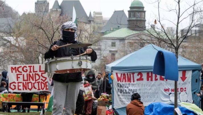 A drummer plays at a protest encampment at McGill University’s campus in Montreal. (Peter McCabe/Reuters)