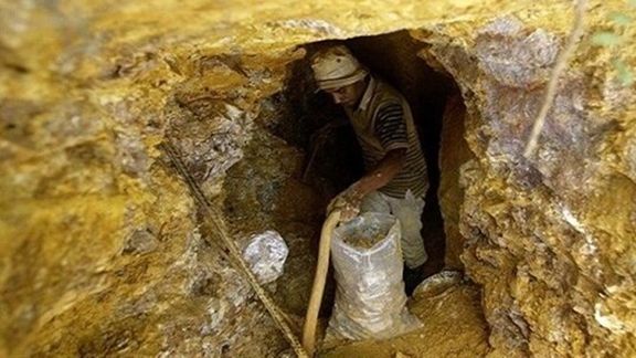 A worker at a gold mine in Iran