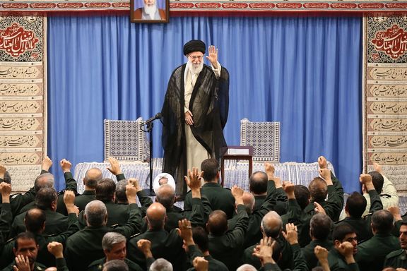Iran's authoritarian rule Ali Khamenei with Revolutionary Guard officers. Undated