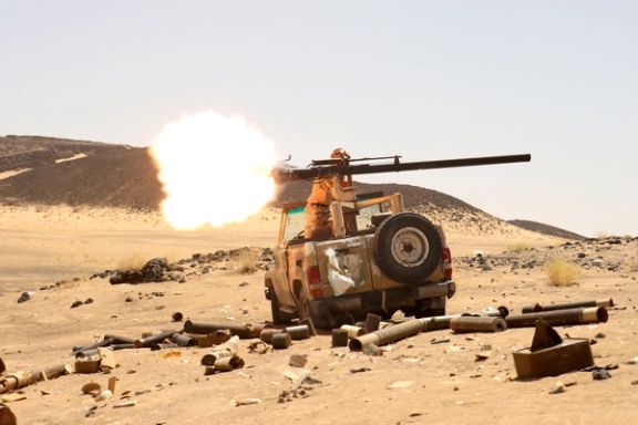 A Yemeni government fighter fires a vehicle-mounted weapon at a frontline position during fighting against Houthi fighters in Marib, Yemen March 9, 2021.