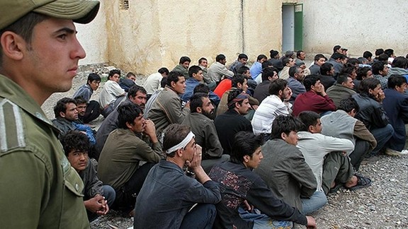 A group of Afghan refugees at the border with Iran