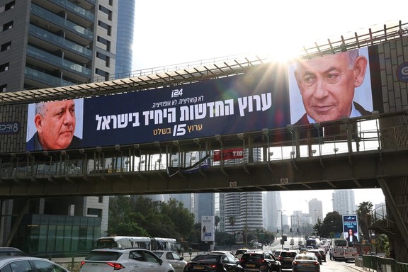An advert for an Israeli television channel that will broadcast Israel's election coverage features Israeli Prime Minister Benjamin Netanyahu and former Israeli military chief Gadi Eisenkot, leader of the Yashar party, ahead of Israel's national election, on a bridge in Tel Aviv, Israel, October 21, 2026.