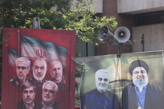 Pictures of those killed in Israeli strikes on Iran are displayed on a street, in Tehran, Iran, June 14, 2025.