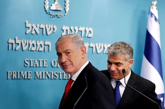 Israeli Prime Minister Benjamin Netanyahu (L) and then Finance Minister Yair Lapid leave after a joint news conference in Jerusalem July 3, 2013.