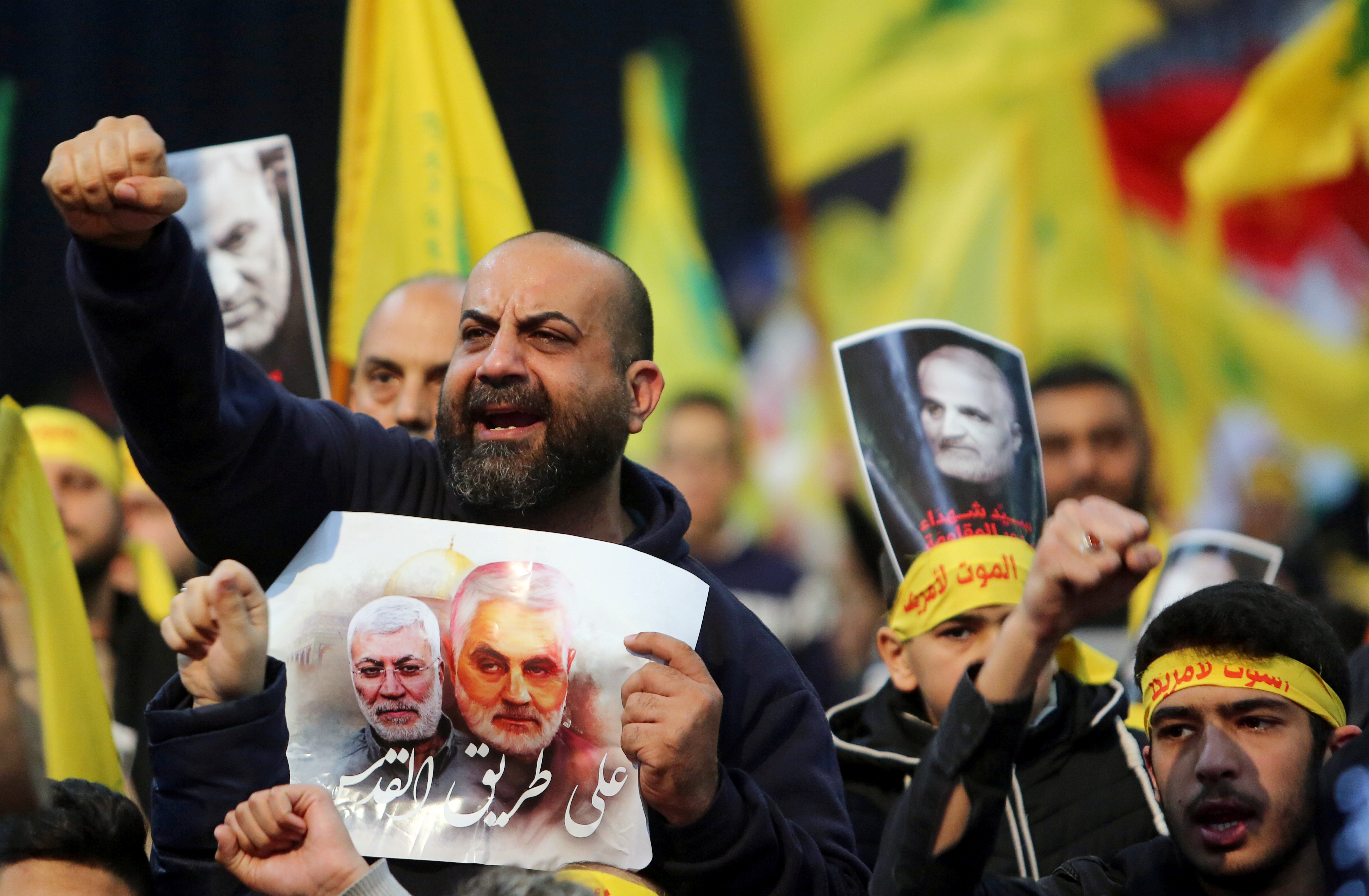 Lebanon's Hezbollah supporters chant slogans during a funeral ceremony rally to mourn Qassem Soleimani, head of the elite Quds Force, who was killed in an air strike at Baghdad airport, in Beirut's suburbs, Lebanon, January 5, 2020.