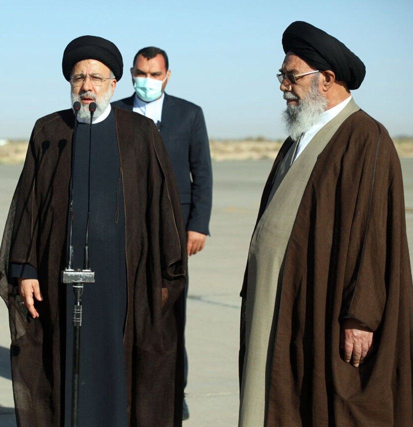 President Ebrahim Raisi (L), the Friday Prayer Imam of Tabriz Mohammad Ali Al-Hashem (R)