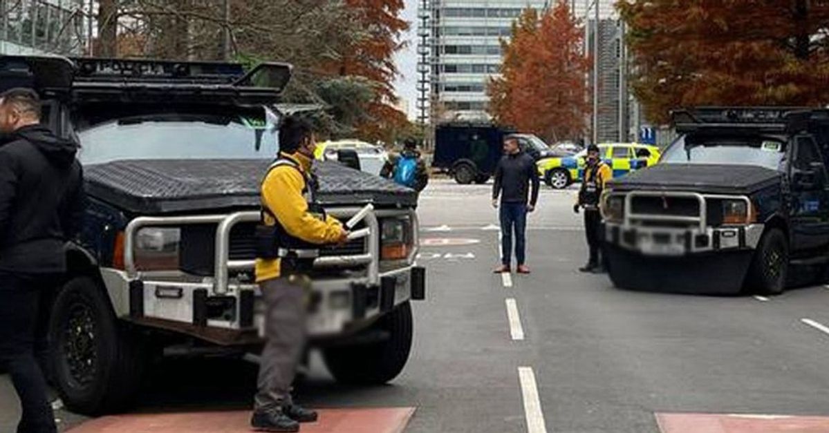 Armored police vehicles are seen outside the headquarters of Iran International on November 19, 2022