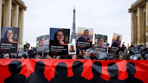Supporters and relatives of French citizens detained in Iran, Cecile Kohler, Benjamin Briere, Jacques Paris and Fariba Adelkhah, gather in front of the Eiffel Tower during a rally demanding their release, in Paris, France, January 28, 2023.