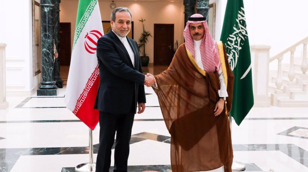 Iranian Foreign Minister Abbas Araghchi (left) shakes hands with his Saudi counterpart Prince Faisal bin Farhan in Jeddah on May 10, 2025. 