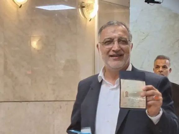 Tehran mayor Zakani showing his iD card during registration on June 1, 2024