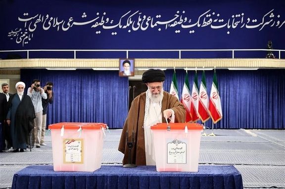 Iran’s ruler Ali Khamenei casting a ballot in Iran’s presidential election in 2017