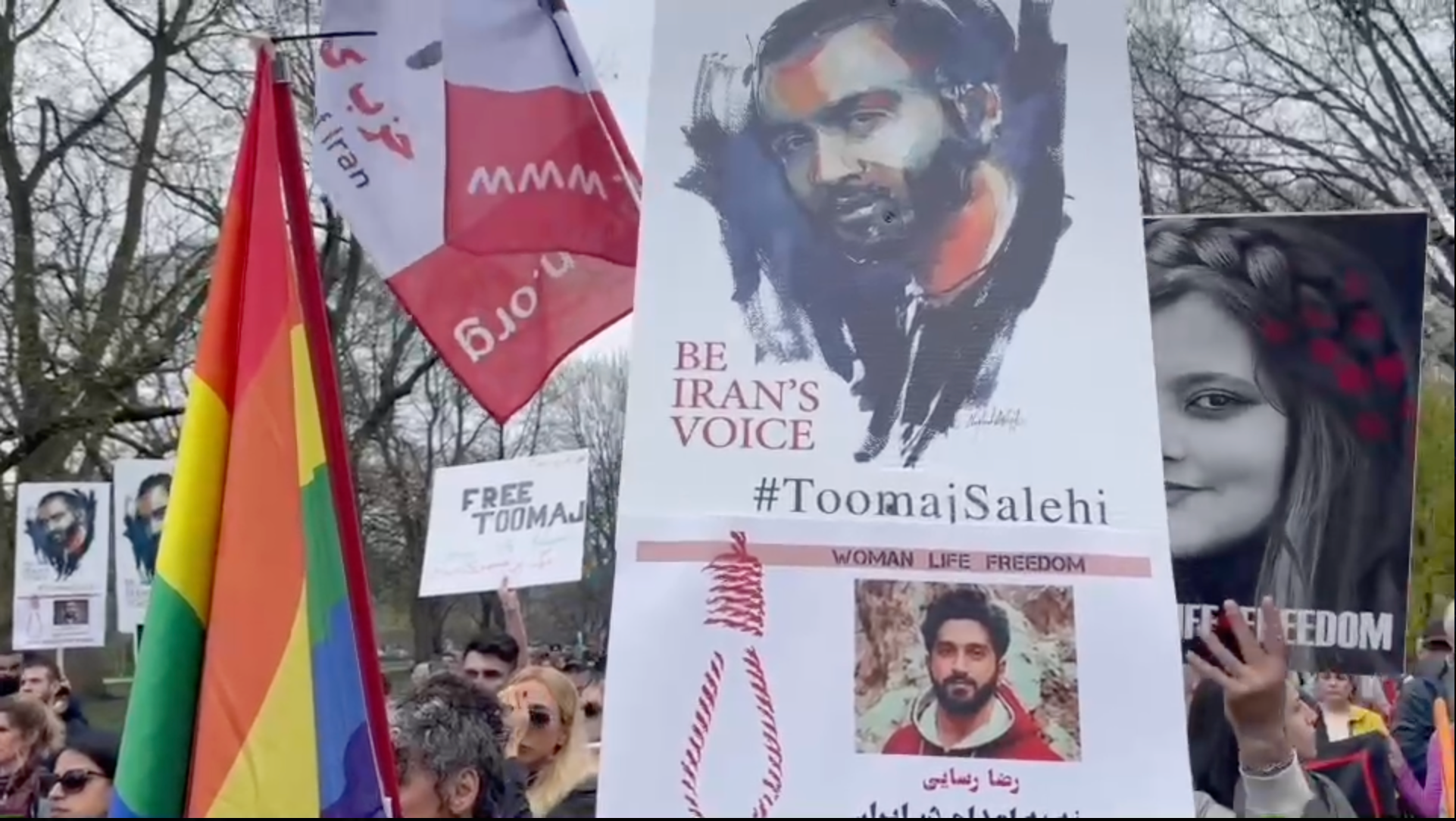 A poster with Toomaj's photo in a protest in Toronto 