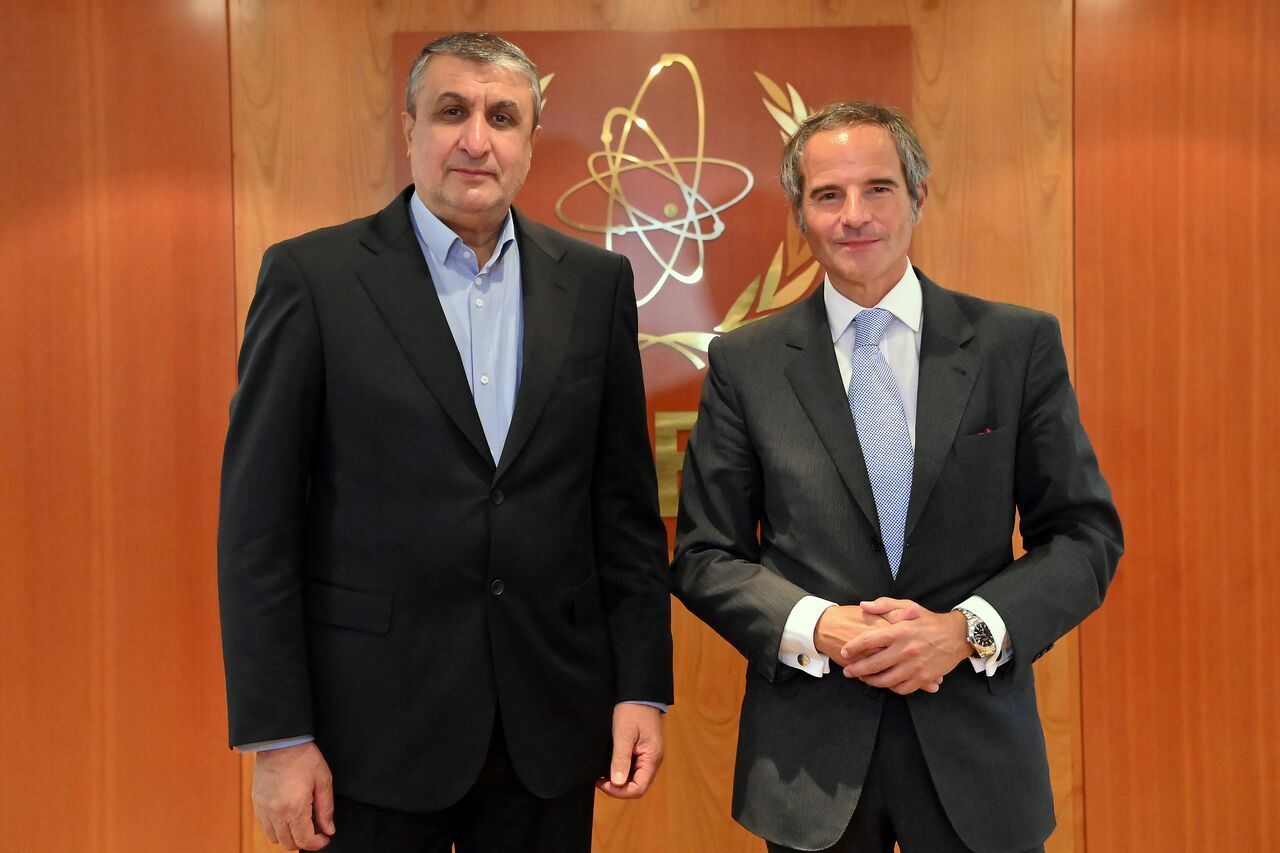 Director General Rafael Grossi of the International Atomic Energy Organization, IAEA, left, and head of Iran's atomic energy department Mohammad Eslami