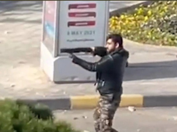 An anti-riot special soldier firing at protesters in Esfahan. November 26, 2021