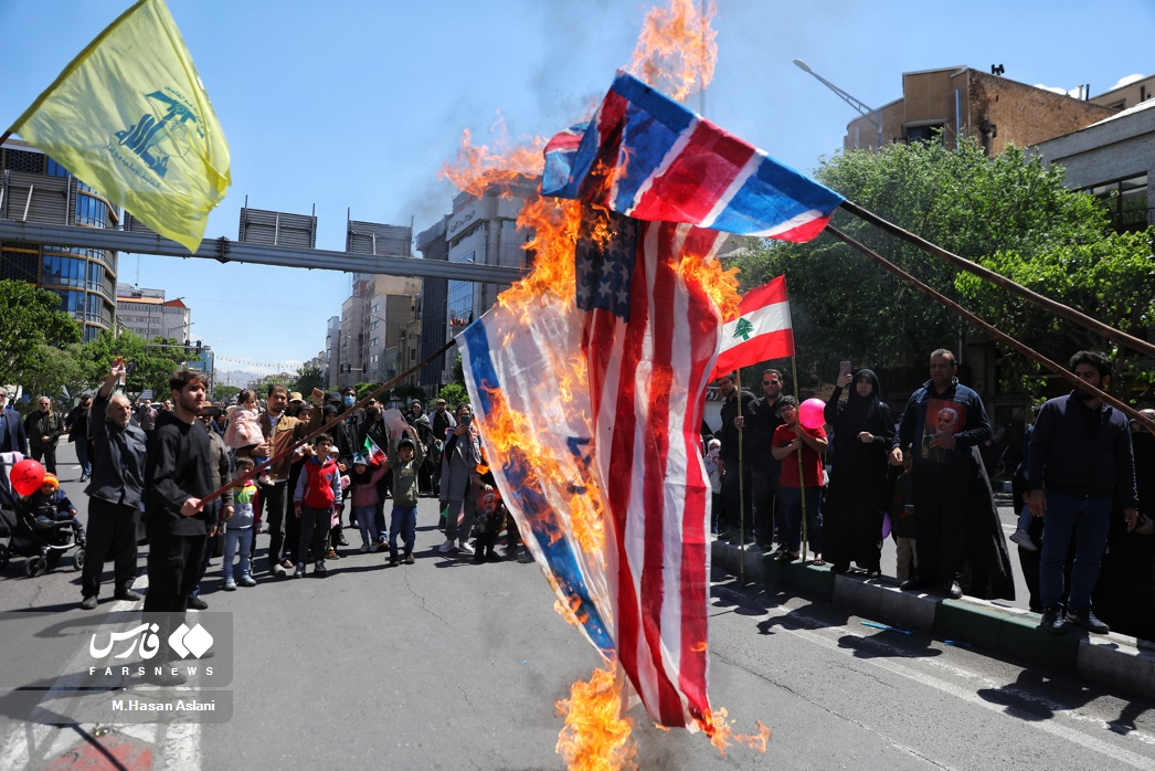 Flags of the US, the UK, Israel being burnt during Quds day rallies in Tehran on April 14, 2023 