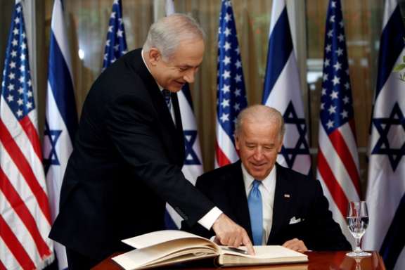 Then Vice President Joe Biden (right) prepares to sign the guest book before his meeting with Israel's Prime Minister Benjamin Netanyahu in Jerusalem March 9, 2010.