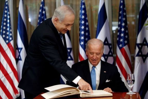 Then-Vice President Joe Biden (right) prepares to sign the guest book before his meeting with Israel's Prime Minister Benjamin Netanyahu at Netanyahu's residence in Jerusalem March 9, 2010.