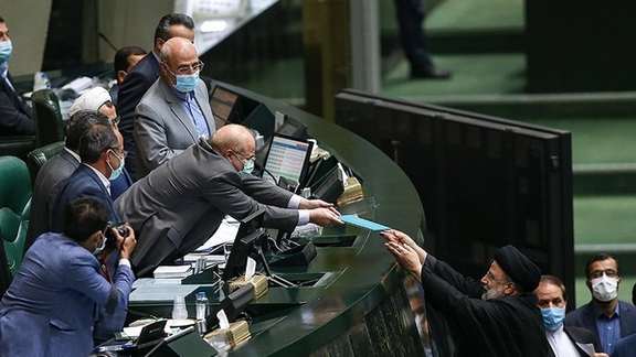 President Ebrahim Raisi submitting the budget draft to Parliament Speaker. December 12, 2021