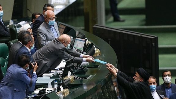President Ebrahim Raisi handing over budget draft bill to Speaker Mohammad Bagher Ghalibaf. December 12, 2021