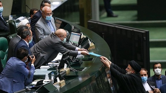 President Ebrahim Raisi presenting his new budget draft to Parliament Speaker Mohammad Bagher Ghalibaf. December 12, 2021
