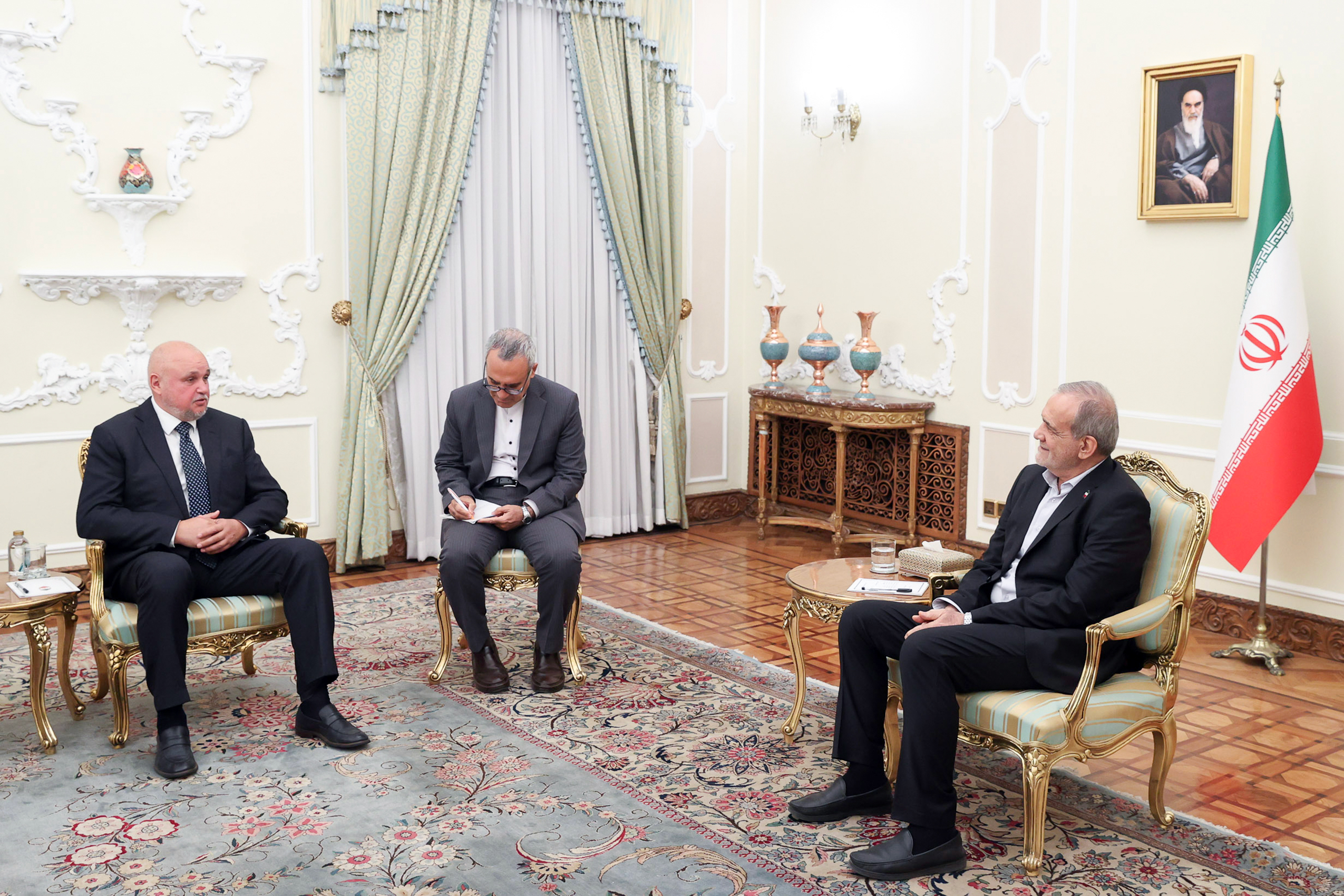 Iran's President Masoud Pezeshkian (right) meeting Russian Energy Minsiter Sergei Tsivilev (left) in Tehran on September 18, 2025.