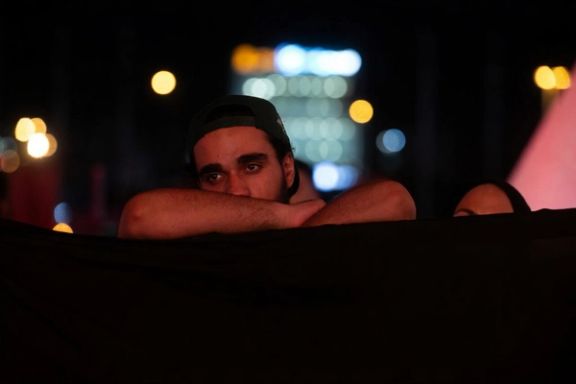 A man attending a religious ceremony marking the death of the third Shiite Imam, July 2025