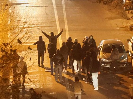 Iranian demonstrators gather in a street during a protest over the collapse of the currency's value, in Tehran, Iran, January 8, 2026.