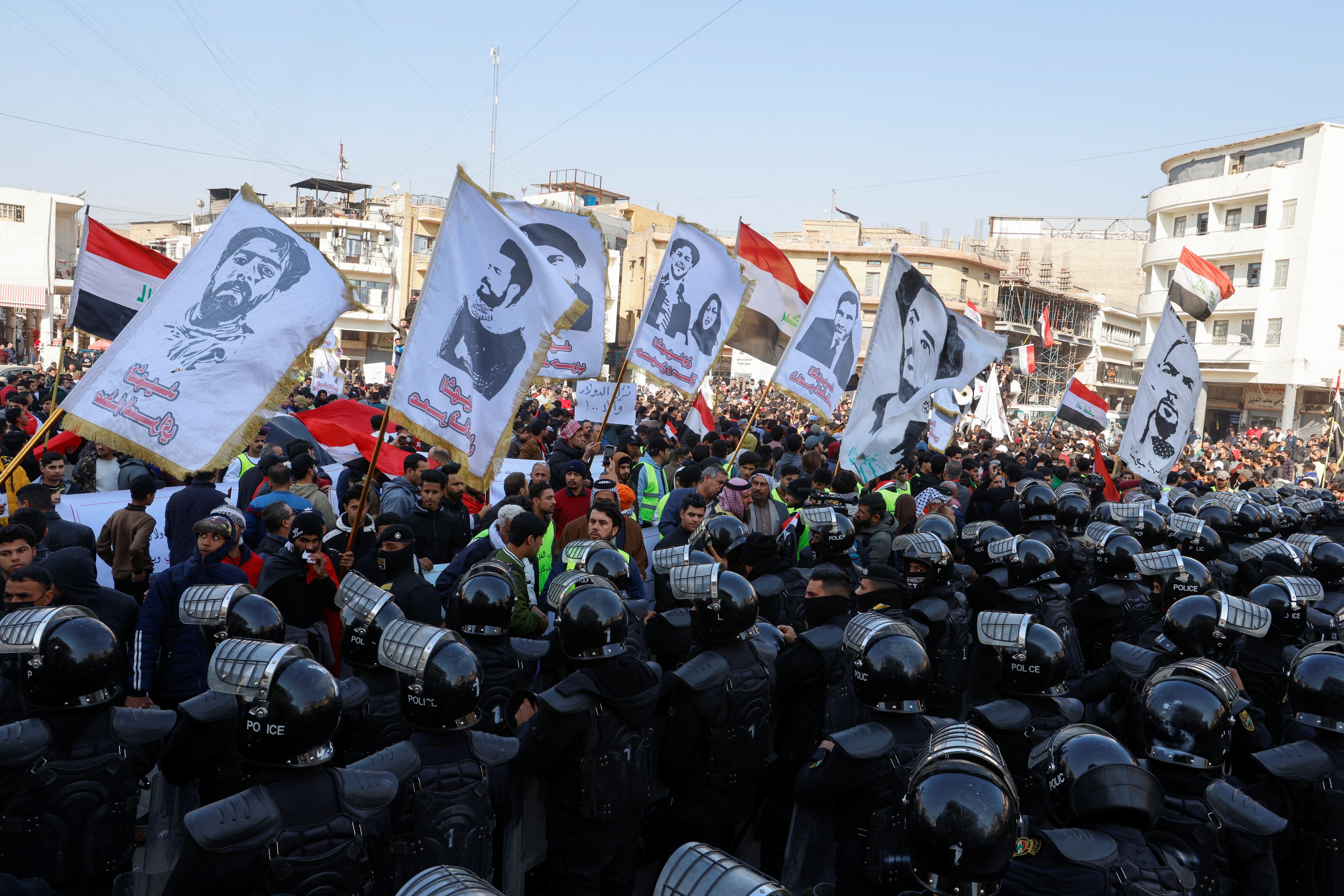 Protesters demonstrate against the dinar's slide in value, near the central bank in Baghdad, January 25, 2023