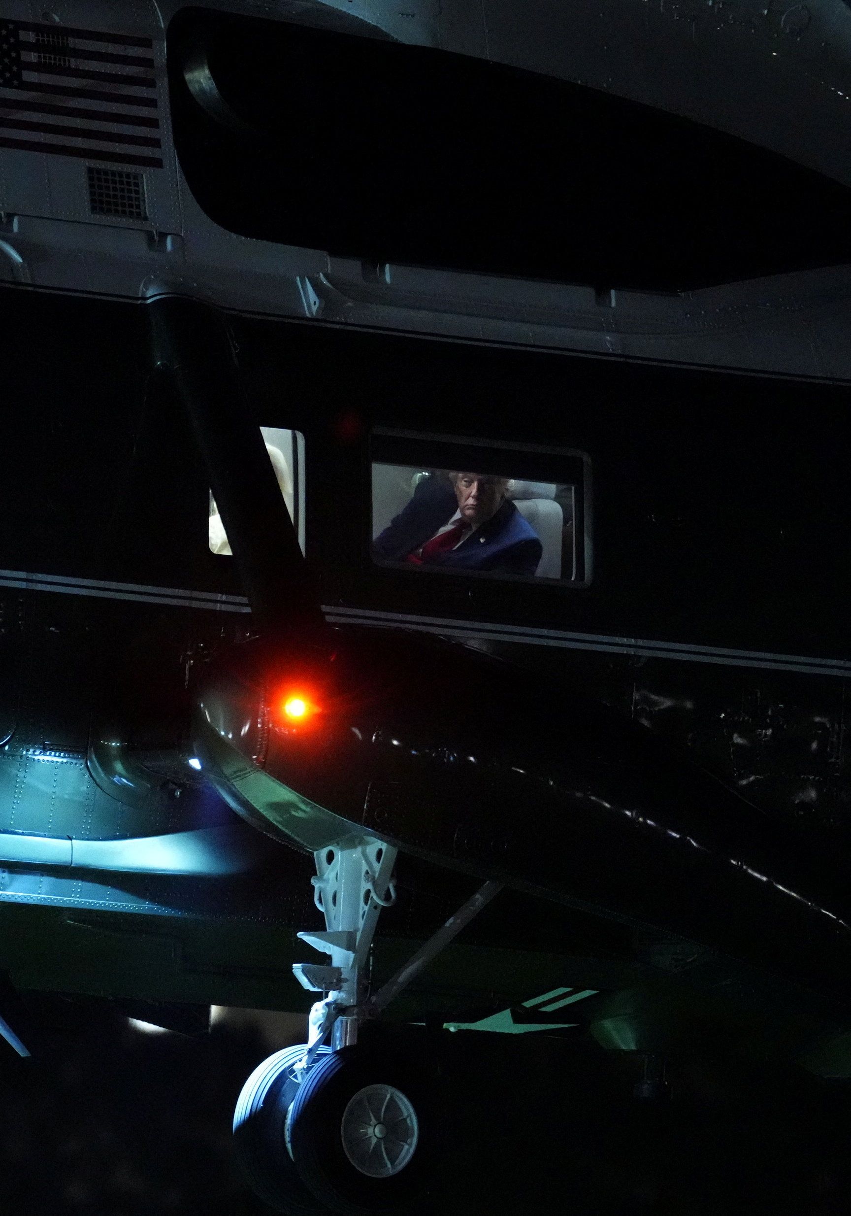 US President Donald Trump looks on before disembarking Marine One at the Ellipse near the White House, in Washington, DC, on August 5, 2026.