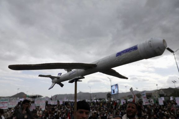 A pro-Houthi protester carries a mock drone at a rally to show support to the Palestinians in the Gaza Strip, Sanaa, Yemen February 16, 2024.