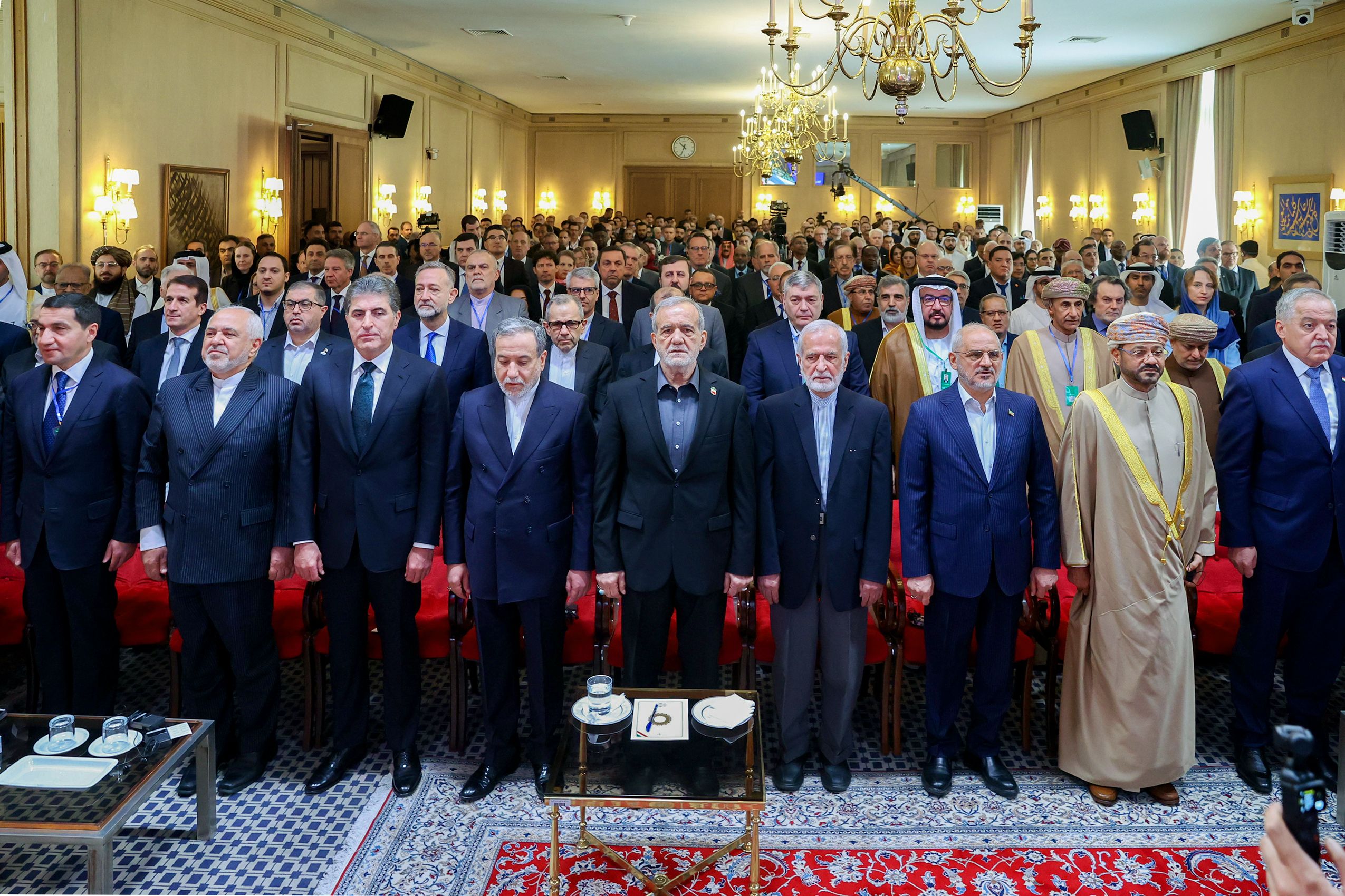 Iranian President Masoud Pezeshkian (center) and senior Iranian diplomats and foreign guests at the Tehran Dialogue Forum on May 18 