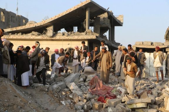 People gather on the rubble of a house hit by a US strike in Saada, Yemen March 16, 2025.