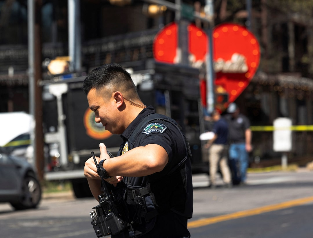 A police officer works at the scene after a deadly mass shooting outside Buford's, a popular roadhouse-style bar in Austin, Texas, US on March 1, 2026.