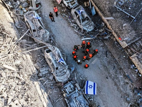 A drone photo of rescue forces at the impact site of residential homes, following a missile attack from Iran on Israel, in Ramat Gan, Israel, June 14