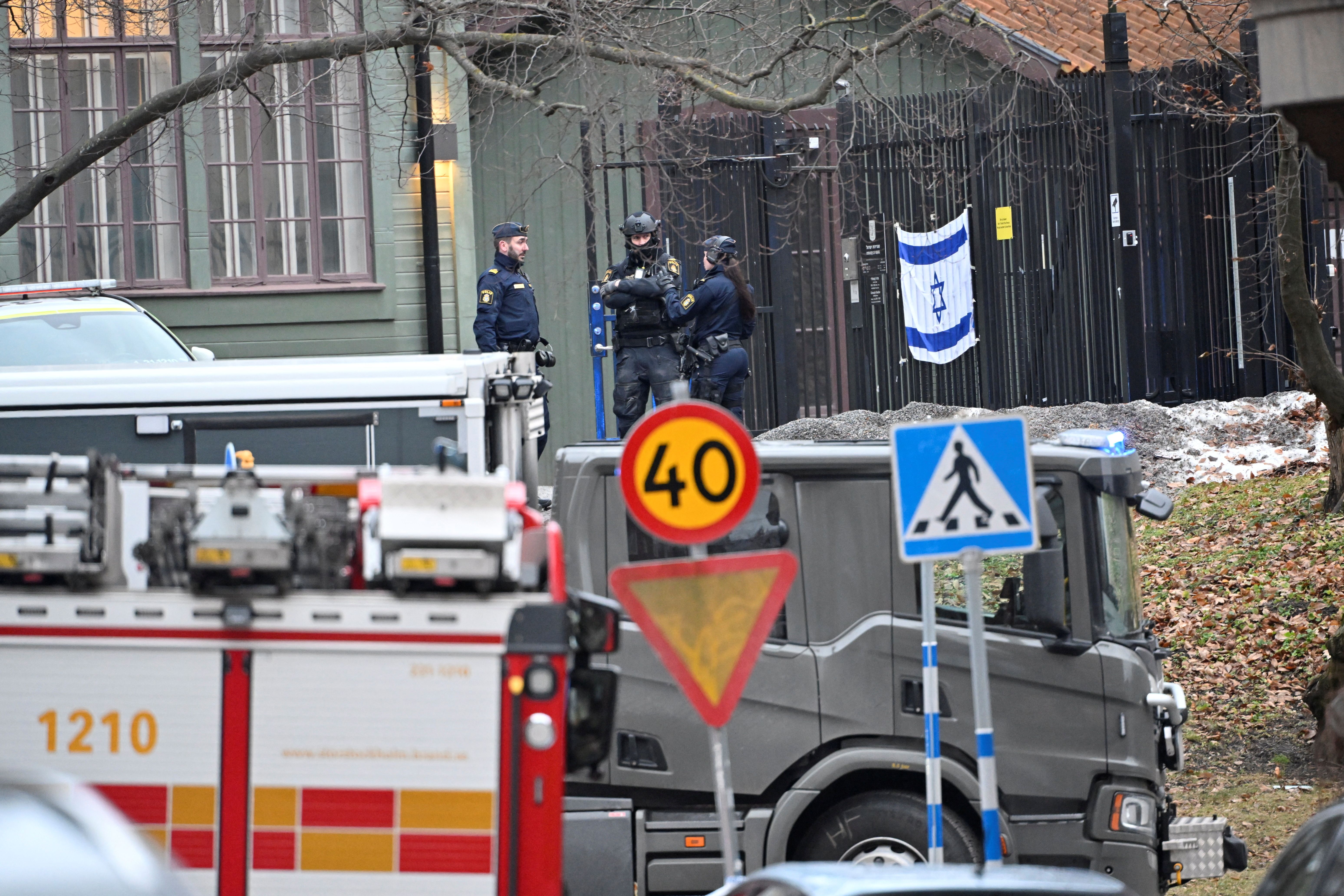 Police officers stand near the Israeli embassy, on the day an object believed to be an explosive device was found and destroyed by the national bomb squad according to police, in Stockholm, Sweden January 31, 2024.