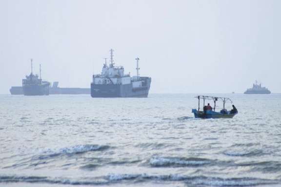Vessels transit the Strait of Hormuz, a key route for global oil shipments.