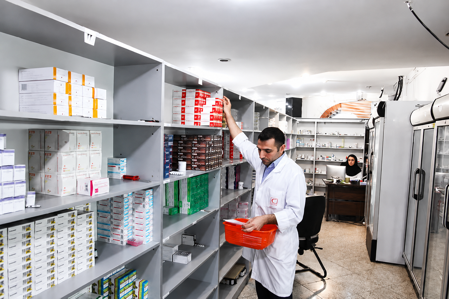 A pharmacist sorts medicines at a pharmacy in Iran.