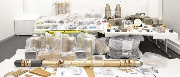 The caches of weapons were seized by Britain's Royal Navy last year
