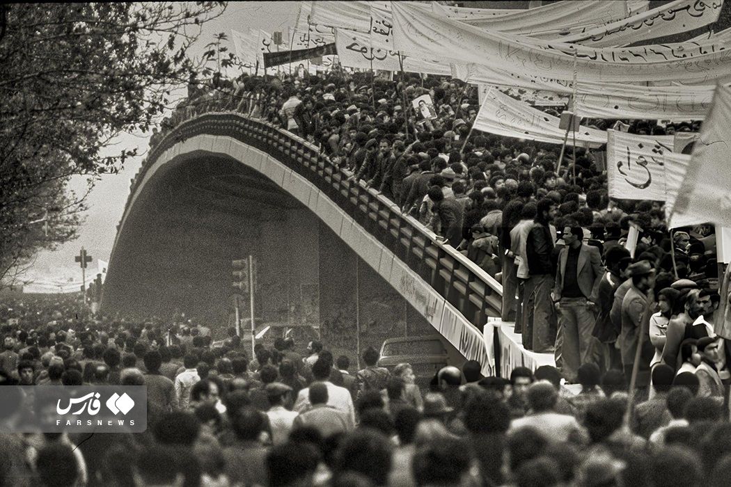 Iranians march on a street in Tehran in February 1979 