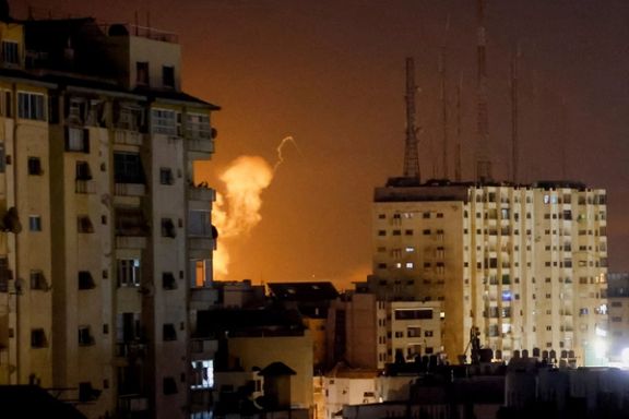Flames rise above Gaza City, during an Israeli air strike on April 7, 2023.