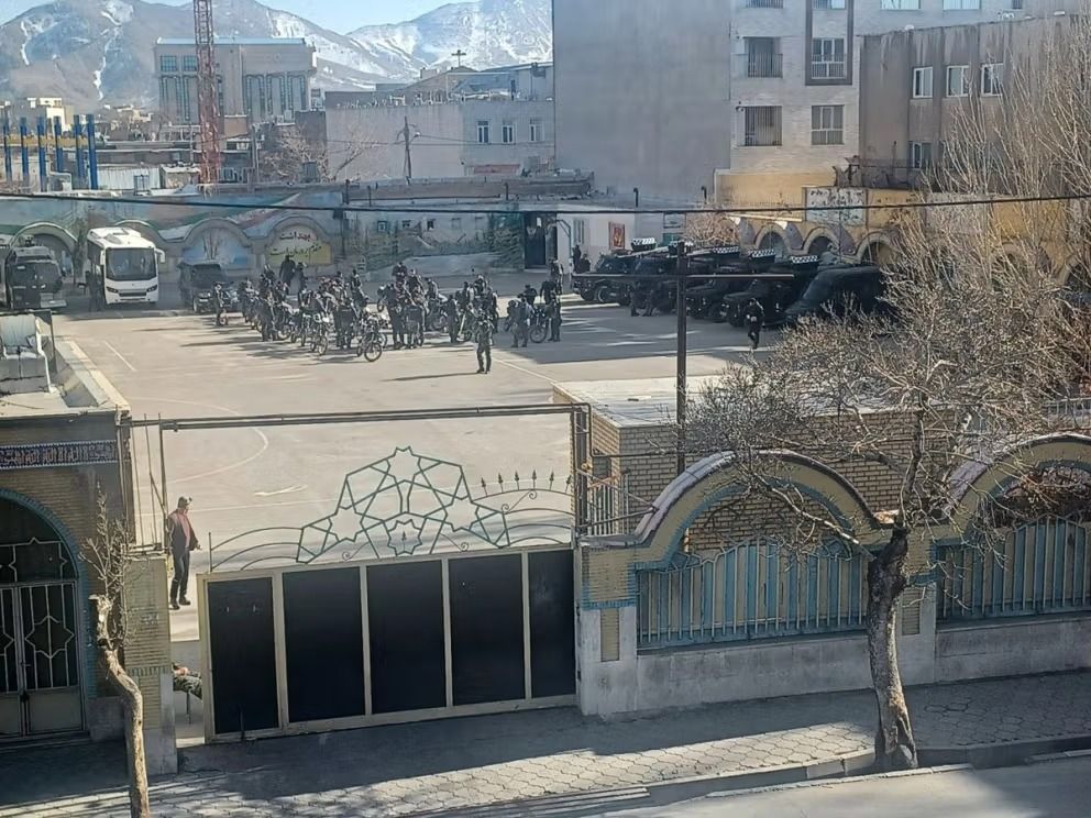 Security forces gather with motorcycles and armored vehicles inside a school courtyard in an image shared on social media in January ahead of a crackdown.