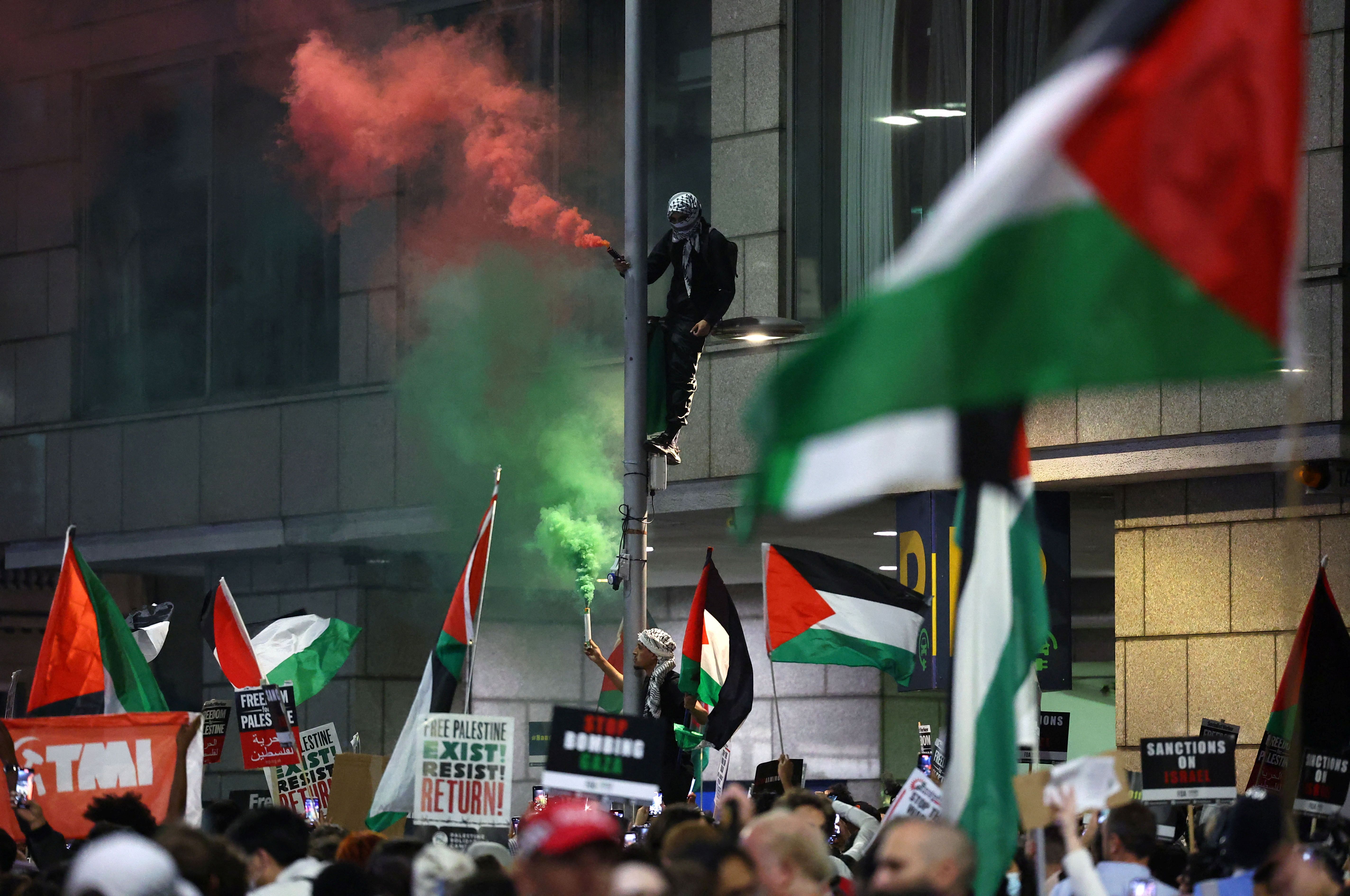 Pro-Palestinian demonstrators protest during the ongoing conflict between Israel and the Palestinian Islamist group Hamas, near the Israeli embassy in London, Britain, October 9, 2023.