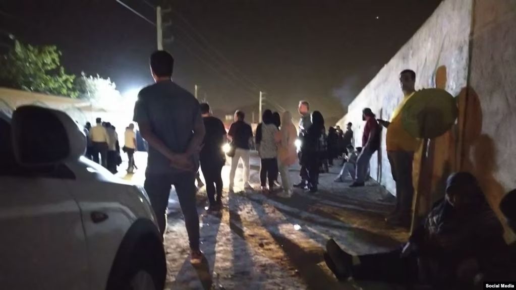 Crowds gathered outside a police headquarters in southeastern Tehran, seeking updates on the status of their loved ones who were arrested during protests on September 16, 2023. 