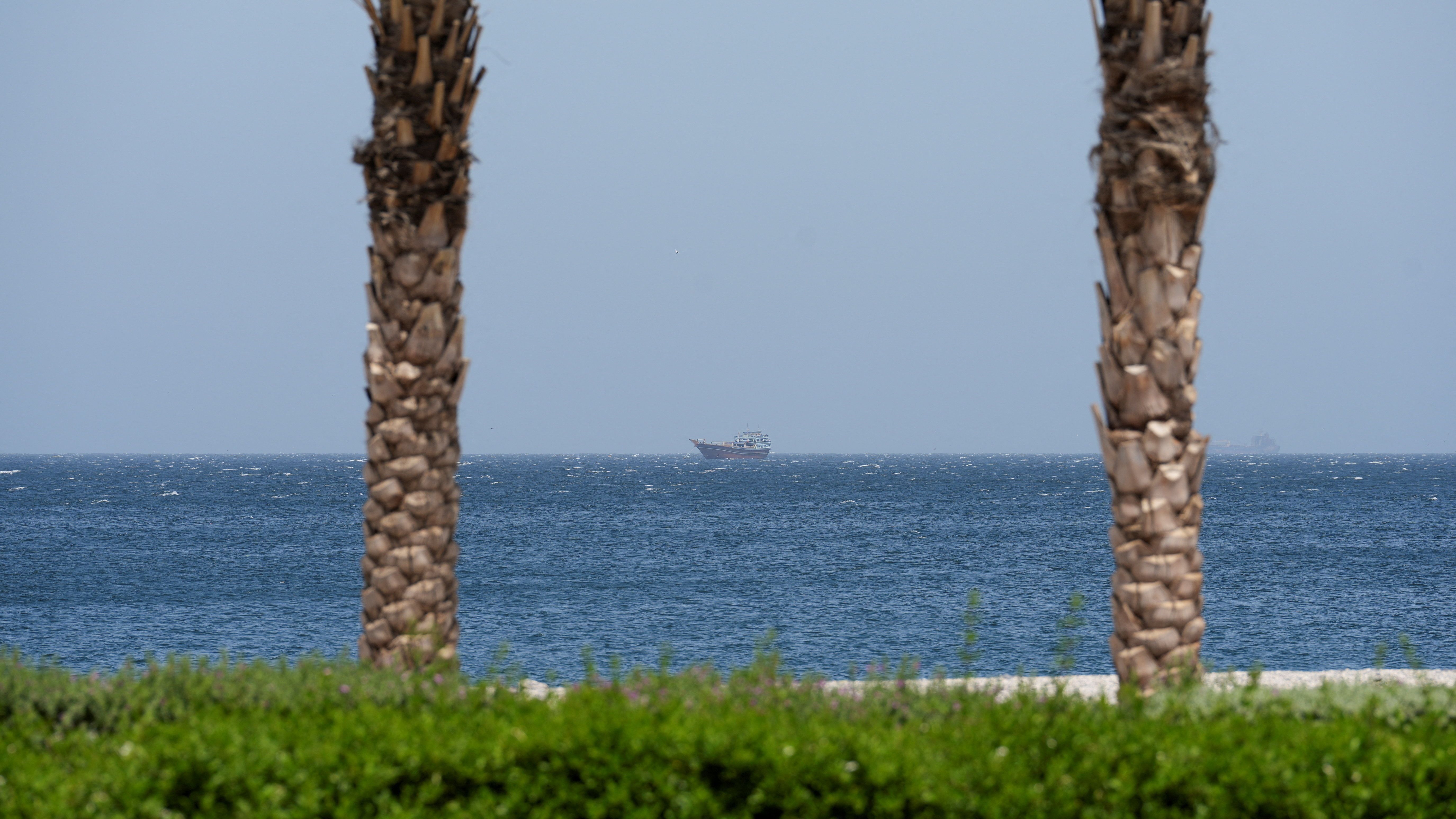 A boat is off the coast of Musandam governorate, overlooking the Strait of Hormuz, in Musandam governance, in Oman, on April 8, 2026.